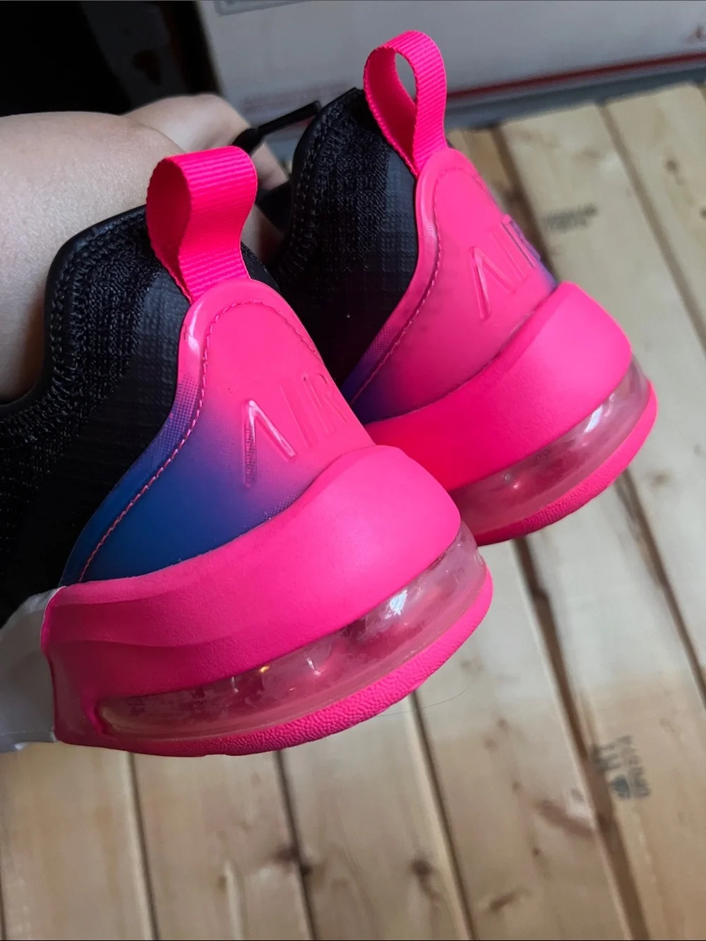 Nike Women's Black Sneaker with Blue Swoosh and Pink Heel